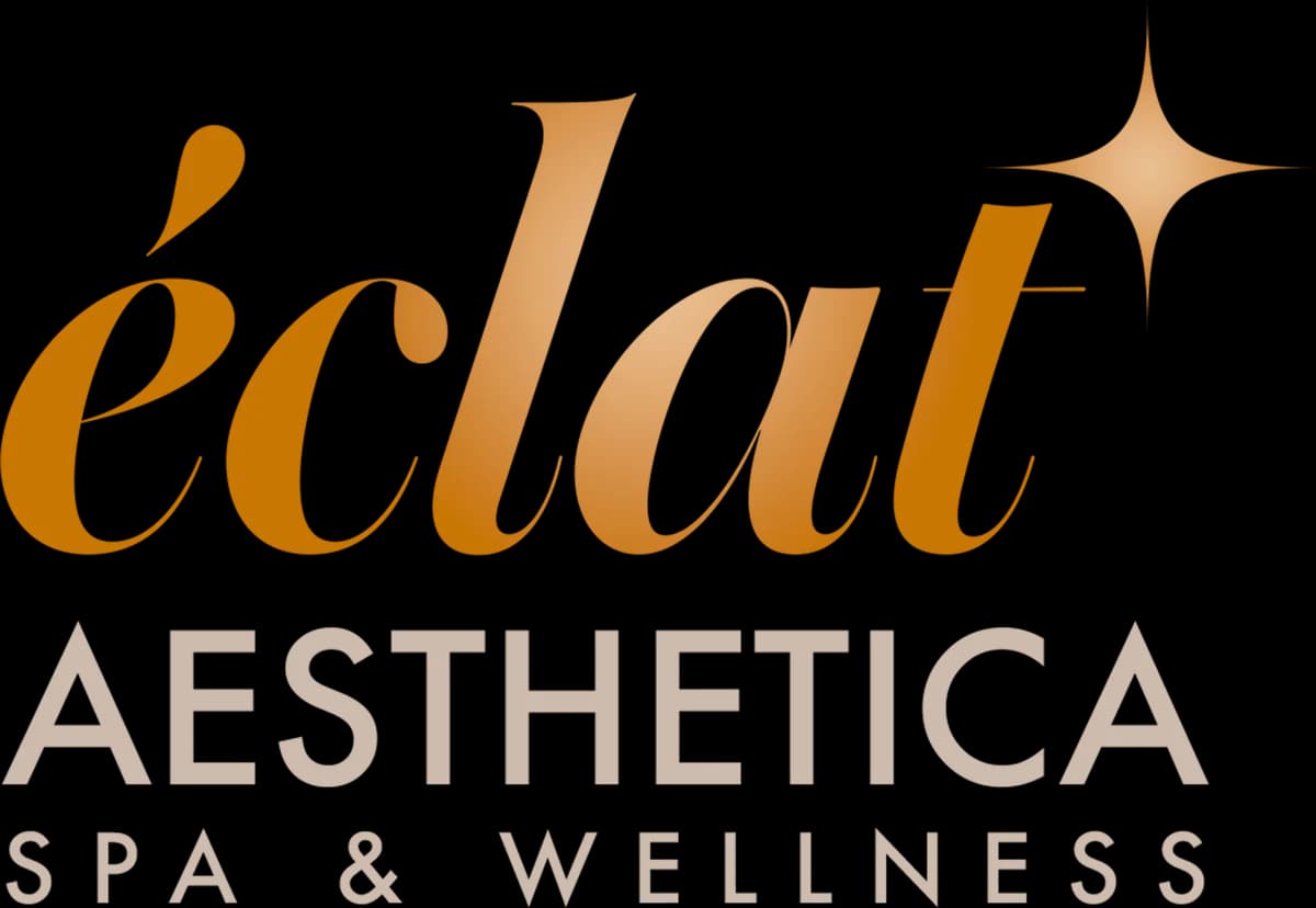 The stacked éclat lockup: the wordmark above AESTHETICA above SPA & WELLNESS, centered.