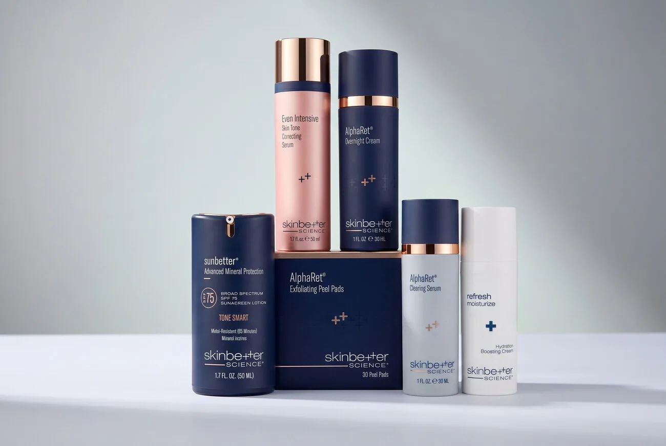 An editorial still life of a skincare product range, grouped into a single shot in the brand's warm palette.