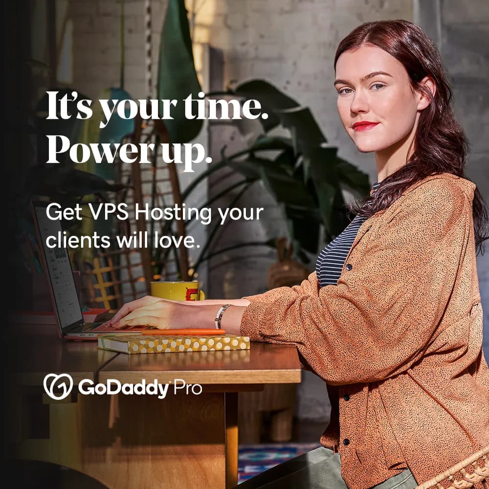 Paid social ad for GoDaddy Pro VPS Hosting: a designer working at a desk, headline 'It's your time. Power up.'